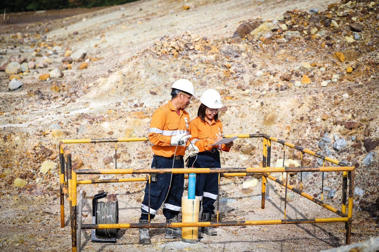 Stockpiled processed material at an industrial mineral site