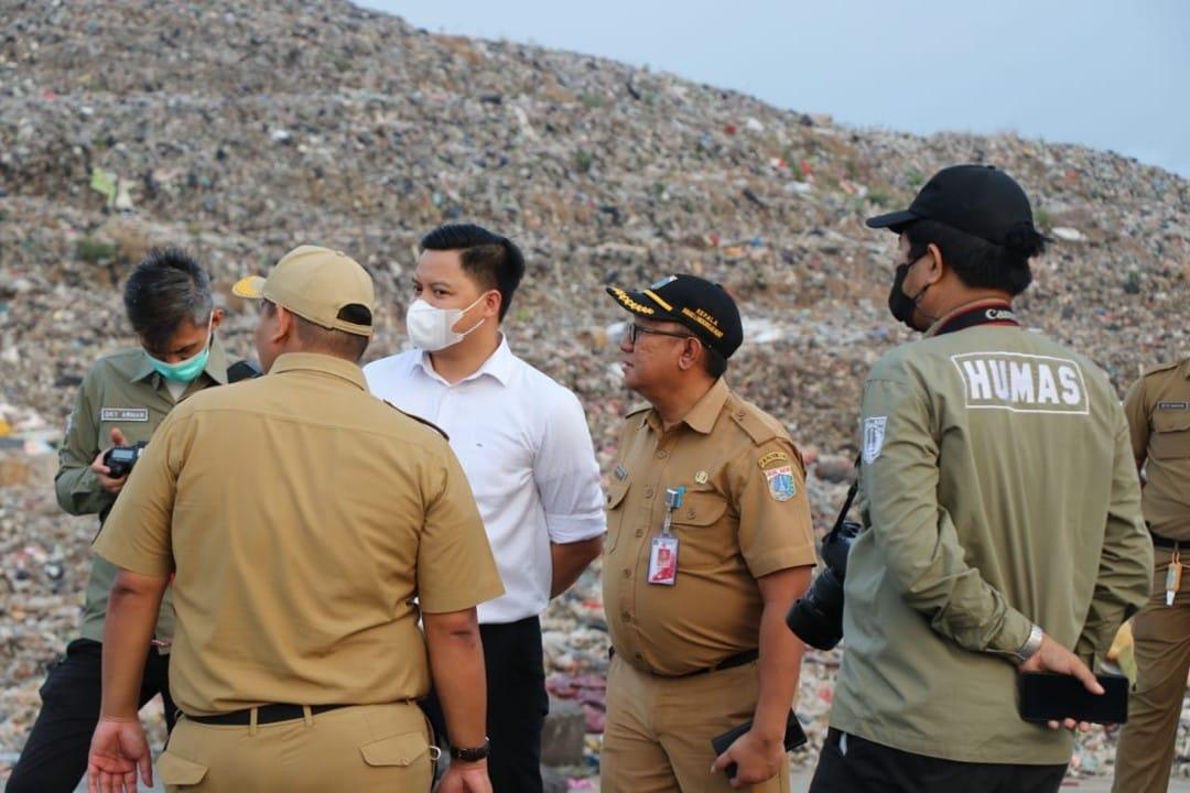 Local government officials inspecting an open dumping landfill site